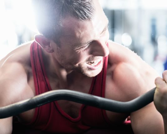 muscular-man-trying-his-best-to-lift-weights-1